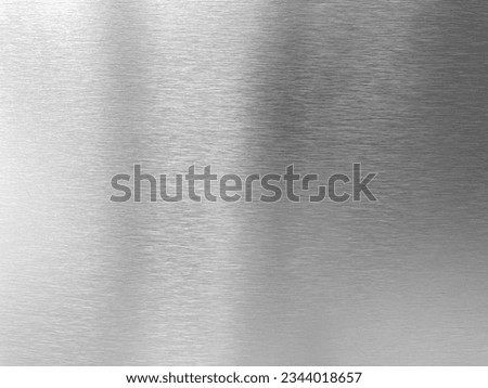 Shiny silver brushed stainless steel plate background. Abstract metal texture background or aluminium banner. Chrome platinum surface sheet material.
