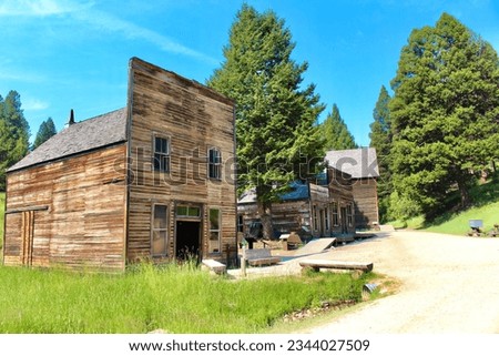 Garnet, Montana, United States of America - August 2, 2023: Abandoned buildings in the forest Royalty-Free Stock Photo #2344027509
