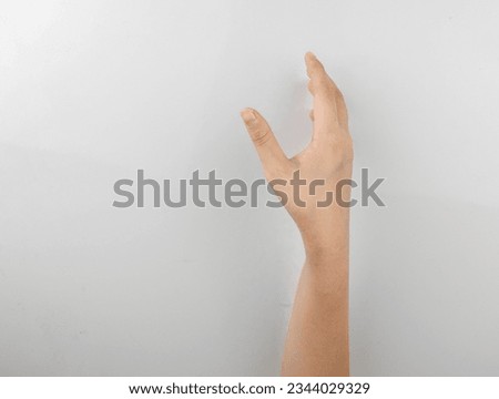 little girl hand something empty back side.
Hand isolated on white background.