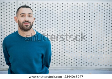 A self-assured young caucasian man exudes confidence, his demeanor reflecting a strong sense of self-belief and assurance in this portrait Royalty-Free Stock Photo #2344065297