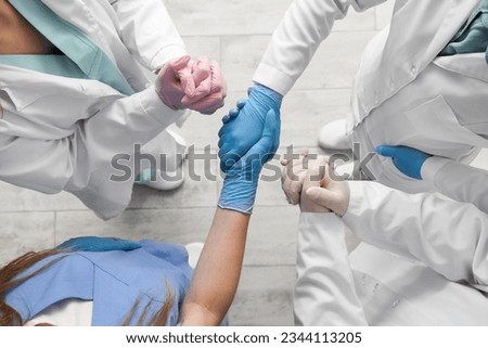 Doctors in medical gloves at clinic, top view Royalty-Free Stock Photo #2344113205