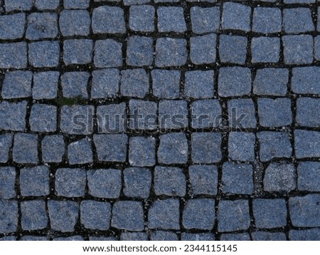 Stone pavement close up photo texture.