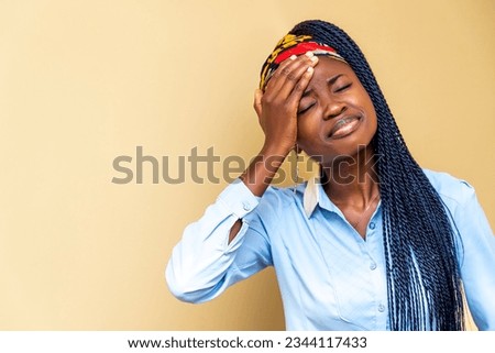 woman in distress, holding her head in her hands Royalty-Free Stock Photo #2344117433