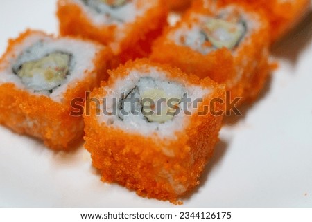 Ebiko and Seaweed Sushi Roll