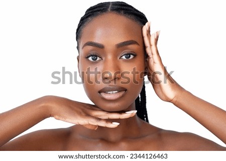 Face building. Facial gymnastic. Self massage. Skin lifting.  Skincare procedure. Beauty portrait of African American young woman with braids hairstyle is showing face symmetry gesture Royalty-Free Stock Photo #2344126463