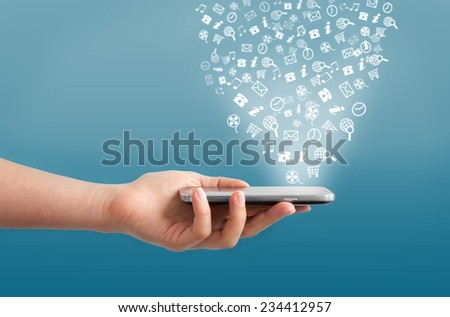 Hand holding smartphone with icons on a blue background