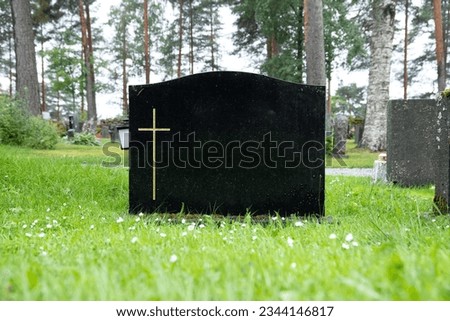 blank black colored gravestone at cemetery during daytime Royalty-Free Stock Photo #2344146817