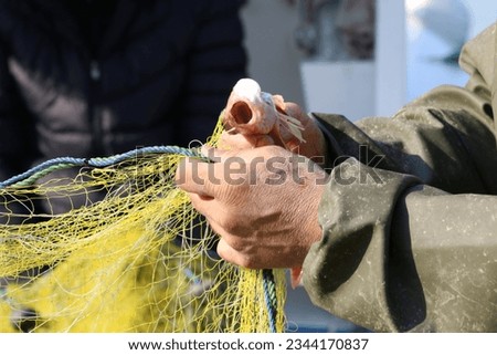 People fishing at Istanbul Beykoz beach, selective focus