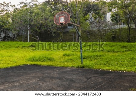 Empty Basketball Court on Sunny Day at Taman Dayu Pandaan, Pasuruan, Indonesia, East Java.