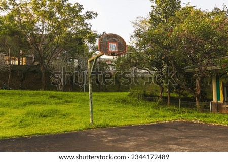 Empty Basketball Court on Sunny Day at Taman Dayu Pandaan, Pasuruan, Indonesia, East Java.