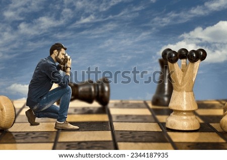 Photographer with vintage camera and chess queen	