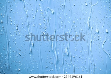 Raindrops fell on the wall and saw the raindrops flowing in a long way.The water flowed through the walls as a stream of water splashed and saw beautiful patterns. Royalty-Free Stock Photo #2344196161