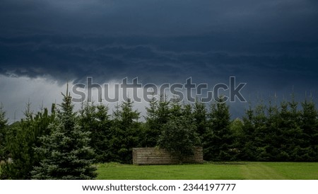 Storm approaching with dark blue clouds and lightning