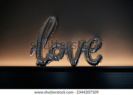 inflatable balls in the form of the word love