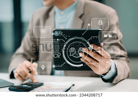 Man using chatbot in computer and tablet  smart intelligence Ai.Chat with AI Artificial Intelligence, developed by OpenAI generate. Futuristic technology, robot in online system. in office

