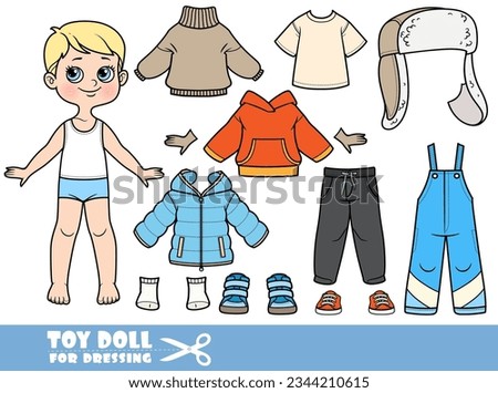 Cartoon blond boy - winter season - padded overalls, jacket, hat with ear flaps, sweater, boots and gloves. Doll for dressing Royalty-Free Stock Photo #2344210615