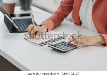 Excited Asian business woman secretary working with product liability, Scarcity, Negotiate, Proposal, Advertising Cost, How to Buy Ads on Any Budget, Interest rate, Dividend, Demand, Remuneration
