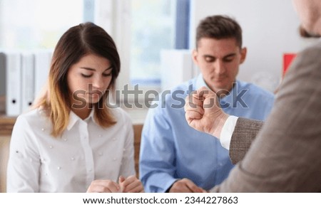 Businessman hand threatens his hired employees Royalty-Free Stock Photo #2344227863