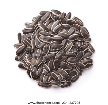 Top view of fresh raw sunflower seeds isolated on white