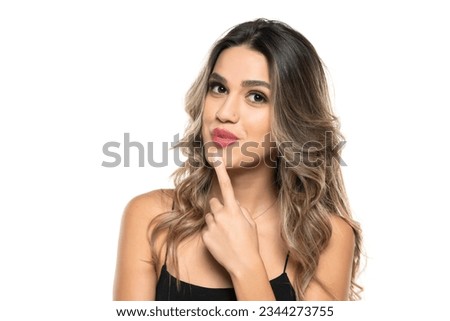 beautiful young happy women with makeup and long wavy hair on a white studio background. Royalty-Free Stock Photo #2344273755