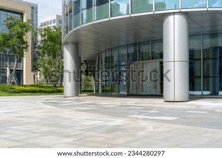 empty concrete floor in front of modern buildings in the downtown street. Royalty-Free Stock Photo #2344280297