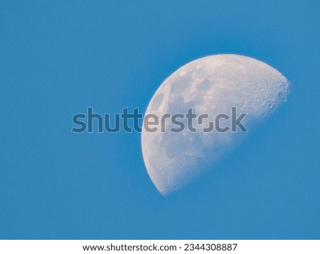 First quarter moon during the day