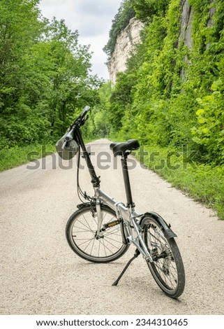 lightweight folding bike on Katy Trail near Rocheport, Missouri, summer scenery. The Katy Trail is 237 mile bike trail converted from an old railroad. Royalty-Free Stock Photo #2344310465