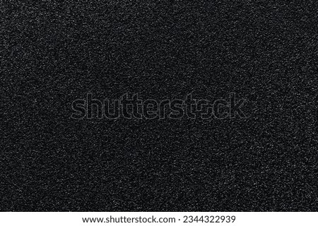 Grainy black plain flat surface texture of blank metal. Premium matte surface Royalty-Free Stock Photo #2344322939
