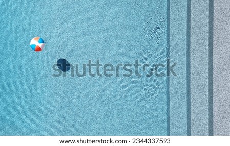 beach ball in a pool (water, minimalist, summer swimming pool party) ripples texture background (lines, steps) shadow, fun, relaxation, relaxing, floating, poolside, colorful, blue