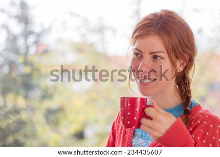 Red head girl enjoying coffee