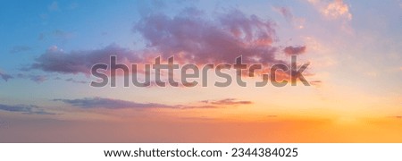 Pastel colors of Majestic real sky with sun - Panoramic Sunrise Sundown Sanset Sky with colorful clouds. Without any birds.  Natural Cloudscape. Large panorama Royalty-Free Stock Photo #2344384025