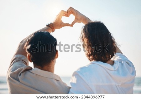 Love, heart hands and gay men on beach, hug from back on summer vacation together in Thailand. Sunshine, ocean and romance emoji, lgbt couple embrace in nature and holiday with pride, sea and fun.