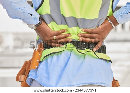 Man, architect and hands in back pain, accident or posture after construction injury on site. Rear view of male person, contractor or engineer with sore spine, muscle or bruise from architecture Royalty-Free Stock Photo #2344397391