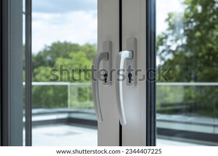 Apartment with secure balcony double glazed doors  Royalty-Free Stock Photo #2344407225