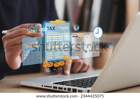 Tax concept. Person using computer to fill out personal income tax return to pay taxes online. State tax. Financial research. data analysis, documents, reports, tax returns, calculations. Royalty-Free Stock Photo #2344425075