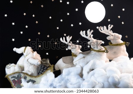 Santa on his sleigh and his reindeer riding into the night with the moon and stars. Cute and fun image of Santa