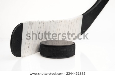 puck and hockey stick taken studio Royalty-Free Stock Photo #2344431895