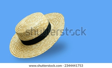 woman hat on blue background Royalty-Free Stock Photo #2344441753