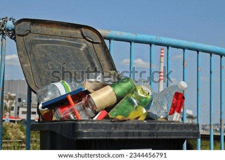 Open bin full of mixed unsorted waste Royalty-Free Stock Photo #2344456791