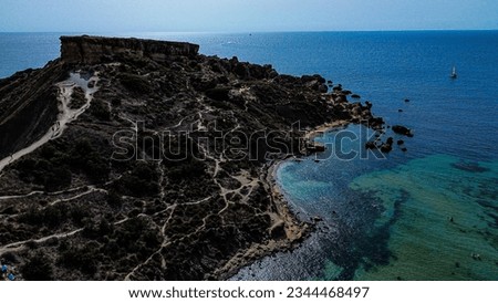 Deep blue sea and blue clay slopes in Malta