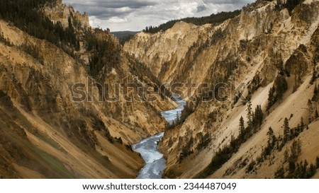 Yellowstone Canyon River Yellow Water Clouds Royalty-Free Stock Photo #2344487049