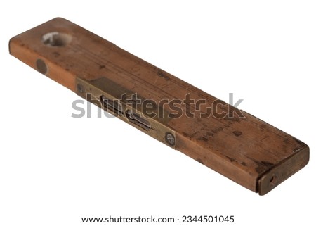 Antique carpenter's boxwood 8 inch ruler with spirit level from 19th century isolated on white background.