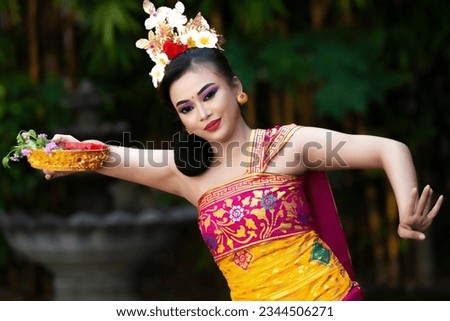 Balinese dancers, Balinese people still adhere to their traditions, including in art.  Balinese dance is well known worldwide and has become a tourist attraction