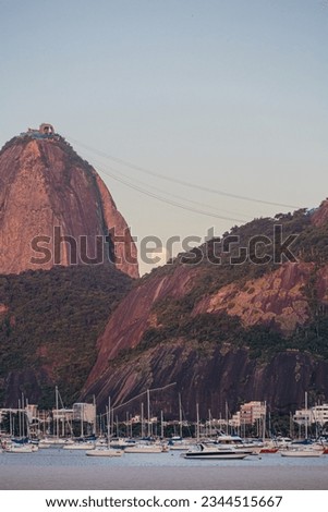 Moonrise behind Sugarloaf Mountain in Rio de Janeiro, Brazil.
