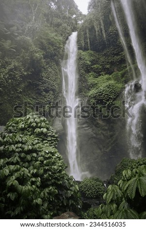 A portrait view of a waterfall