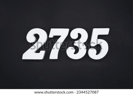 Black for the background. The number 2735 is made of white painted wood.