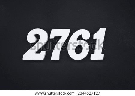 Black for the background. The number 2761 is made of white painted wood.