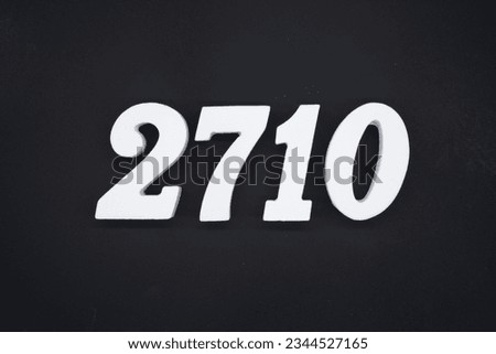 Black for the background. The number 2710 is made of white painted wood.