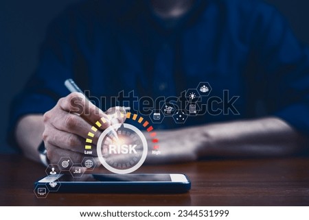 Businessman demonstrates the strategic decision-making in the realm of finance, engages in a analysis of opportunities, navigates the complexities of risk management and strategy on virtual screen  Royalty-Free Stock Photo #2344531999