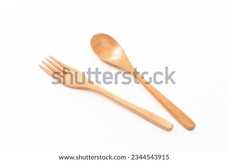 Wooden cutlery on white background.